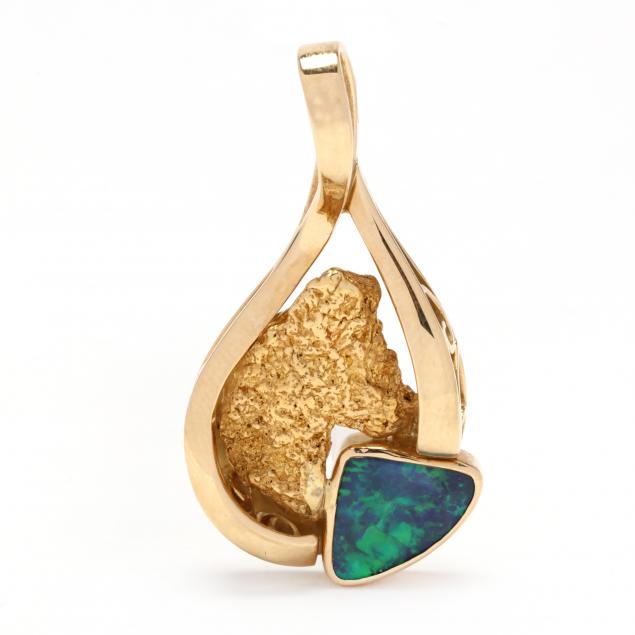 Appraisal: GOLD AND OPAL PENDANT ENHANCER In an open freeform design