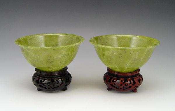 Appraisal: PAIR CHINESE MOTTLED GREEN OLIVINE BOWLS Matched pair lipped polished