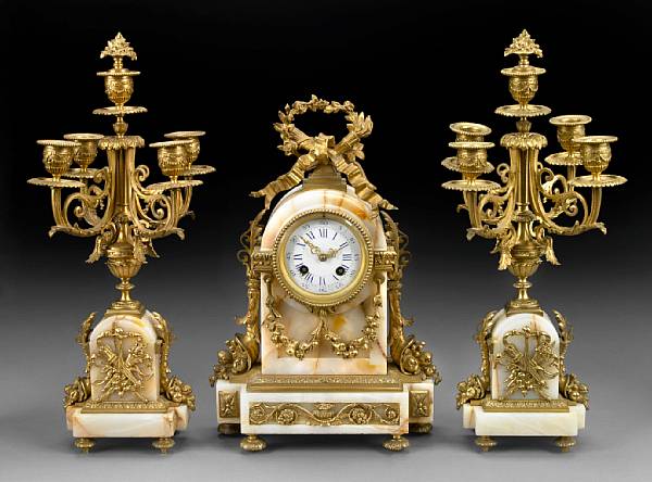 Appraisal: A Louis XVI style gilt bronze and onyx clock garniture