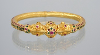 Appraisal: A High Karat Bangle Bracelet with Rubies and Emeralds High