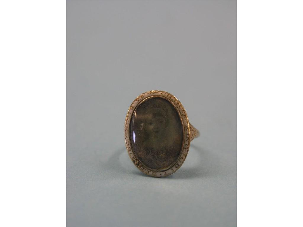 Appraisal: A George III memorial ring inset painted oval portrait of