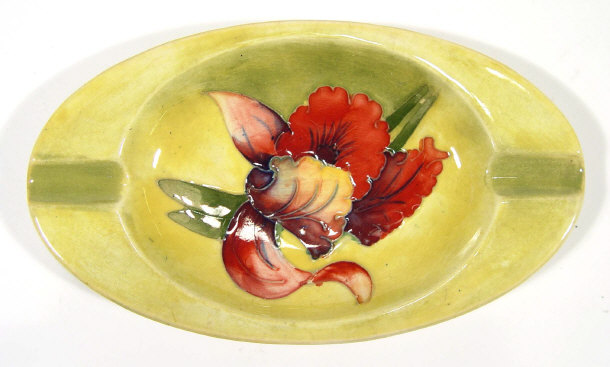 Appraisal: Oval Moorcroft ashtray hand painted with orchids onto a yellow