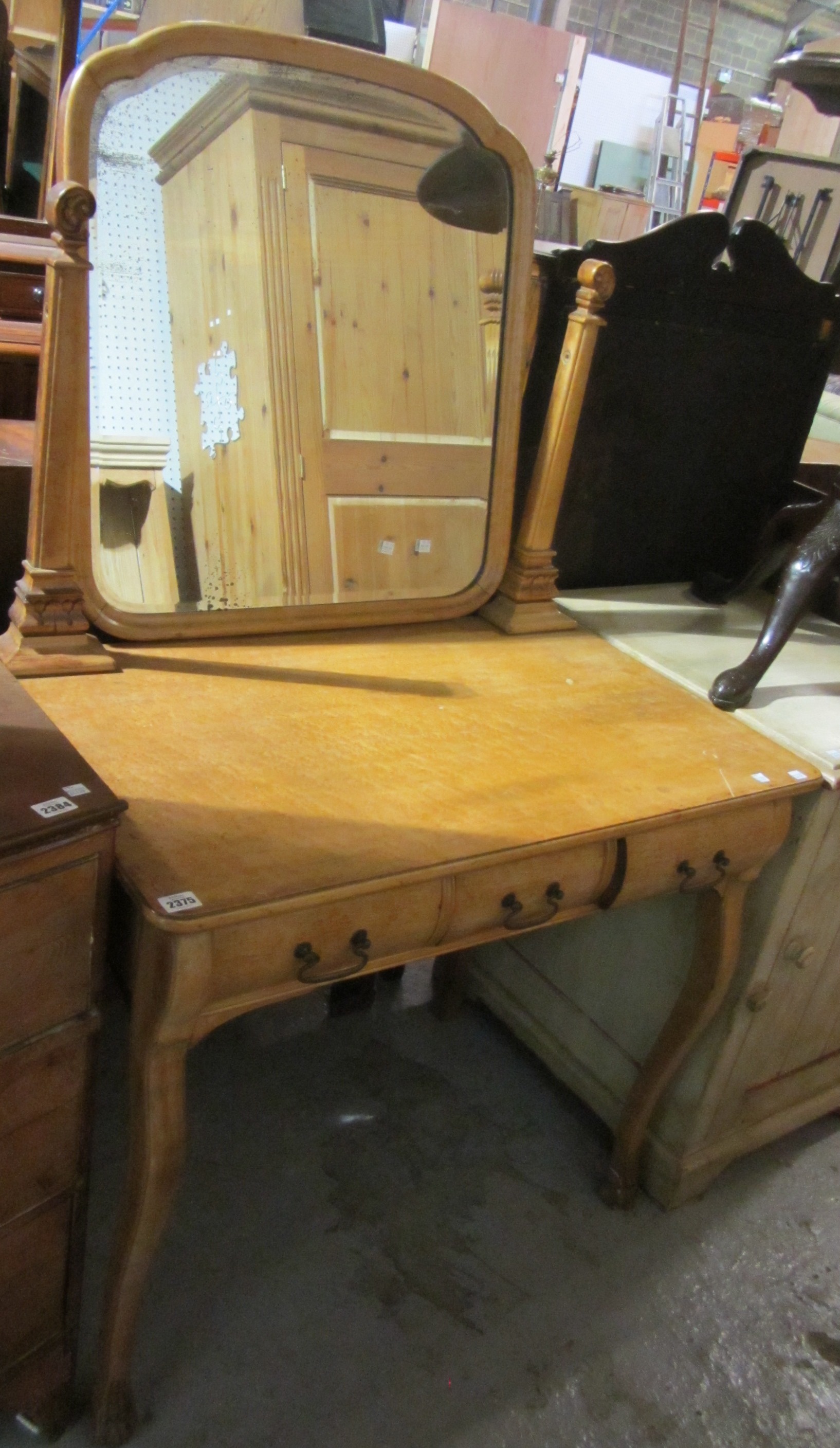 Appraisal: A satin birch dressing table with rectangular mirror