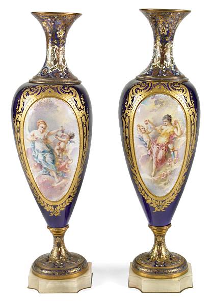 Appraisal: A pair of S vres style porcelain gilt bronze champlev