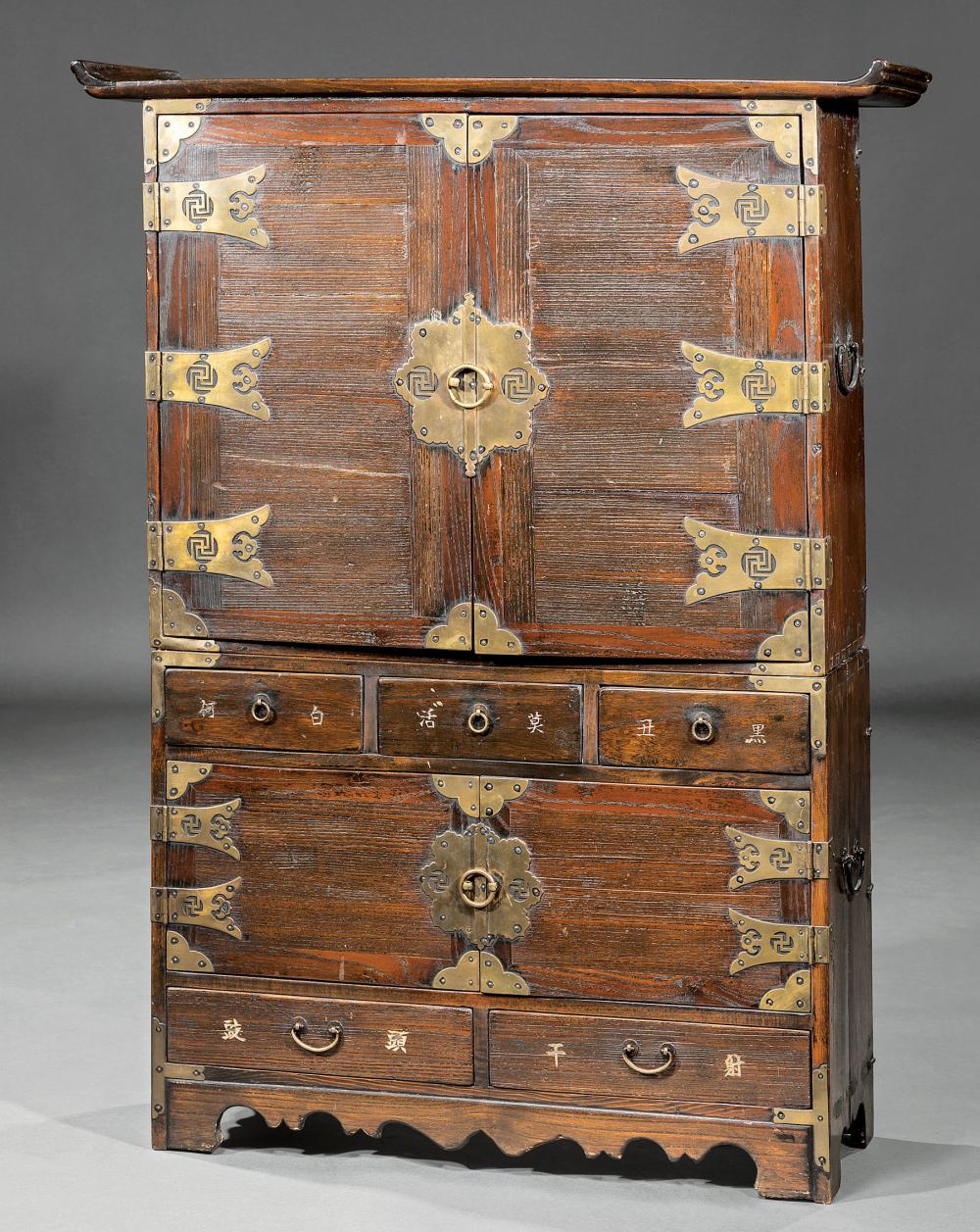 Appraisal: Chinese Brass-Mounted Carved Wood Apothecary or Tea Cabinet-on-Chest upper case