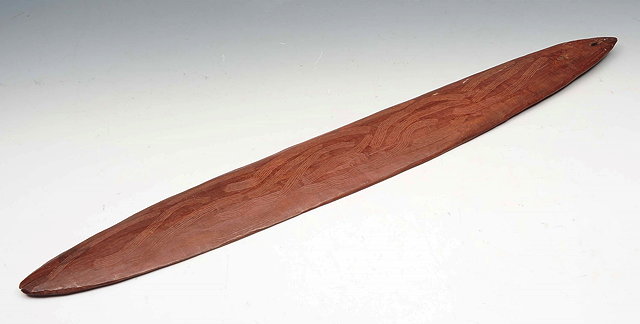 Appraisal: AN ABORIGINAL BULLROARER with incised wavy decoration cm long