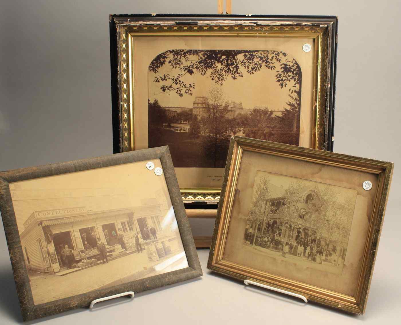 Appraisal: THREE FRAMED PHOTOGRAPHS A boarding house or hotel with thirty