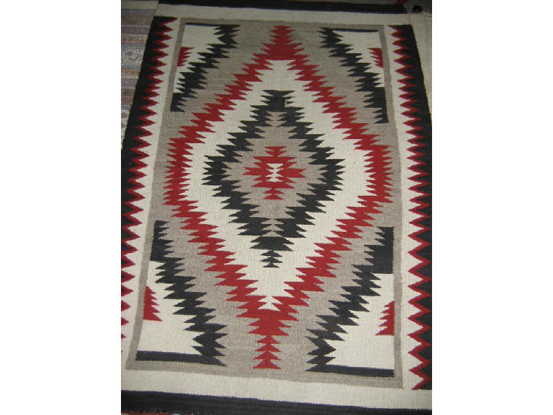 Appraisal: NAVAJO DOUBLE SADDLE BLANKET Serrated diamond pattern in alternating shades