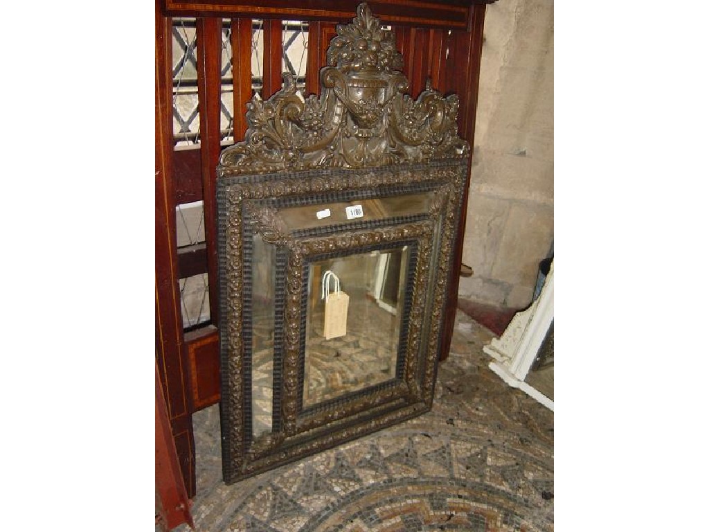 Appraisal: A th century continental brass framed wall mirror with flowering