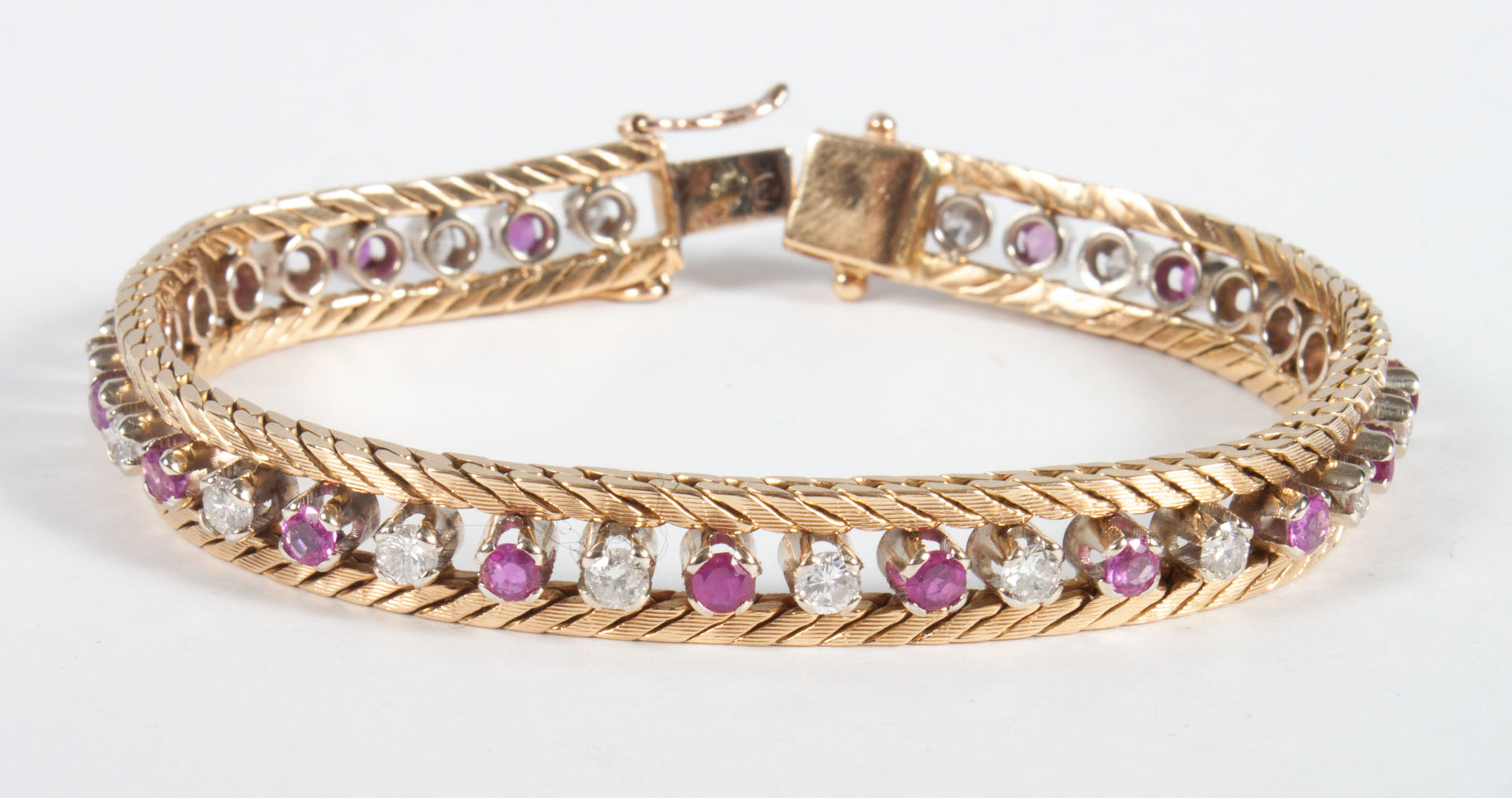 Appraisal: Lady's K gold diamond ruby bracelet in L grams