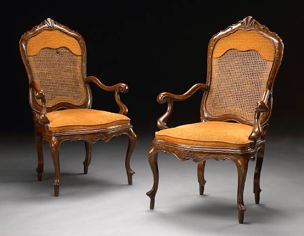 Appraisal: A pair of Italian Rococo paint decorated walnut armchairs third