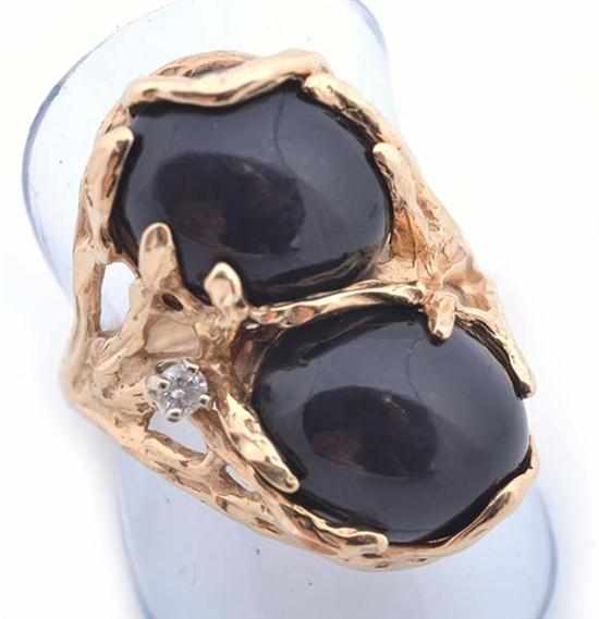 Appraisal: AN ABSTRACT DESIGN ONYX AND CLEAR STONE RING STAMPED CT