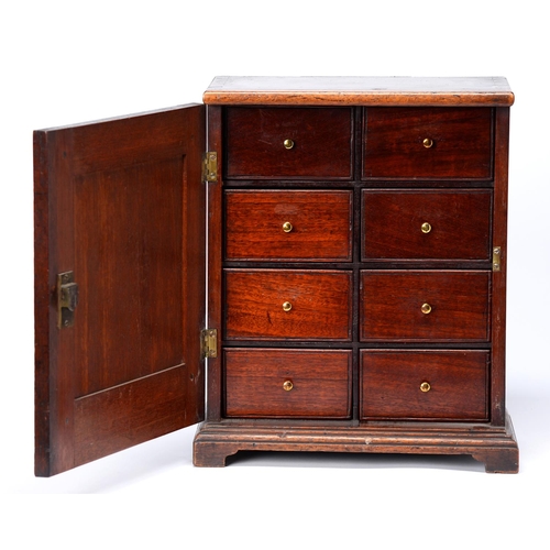 Appraisal: A George III mahogany spice cupboard fitted with eight scratch