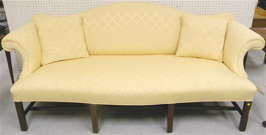 Appraisal: Chippendale style sofa camelback roll arms molded legs yellow upholstery