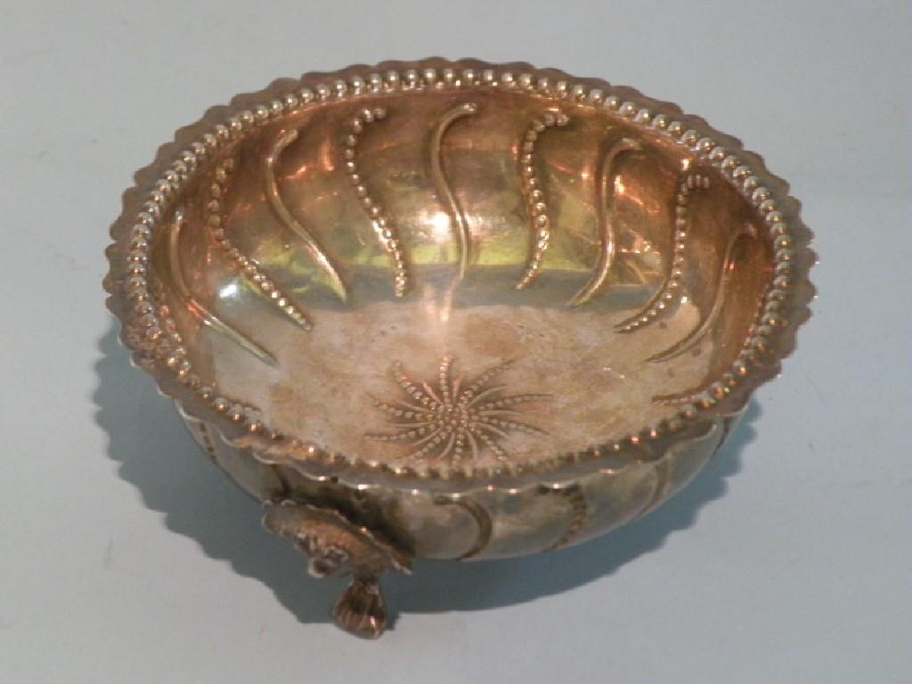 Appraisal: A Victorian silver sugar bowl embossed with beads and scrolls