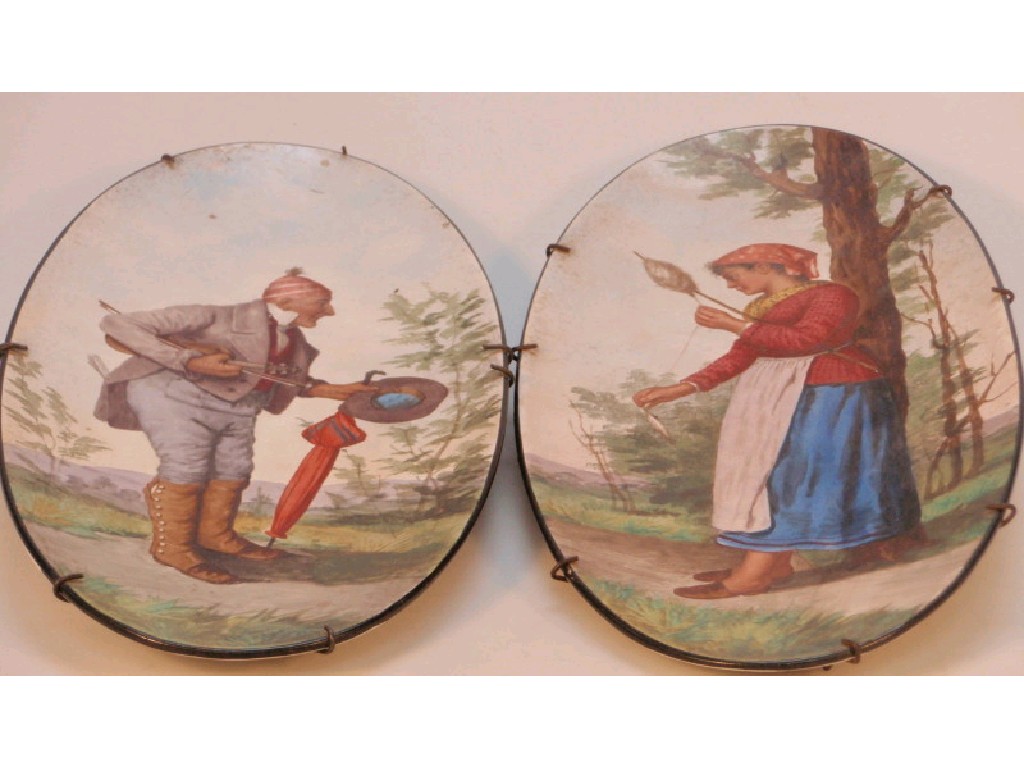 Appraisal: A pair of thC continental oval pottery plaques hand painted