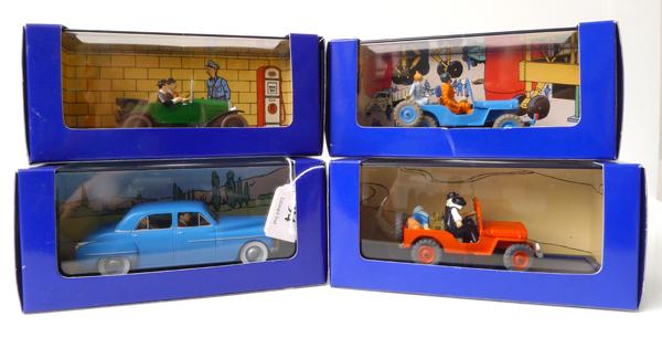 Appraisal: FOUR EN VOITURE TINTIN FIGURES FROM TINTIN COMICS RELEASED IN