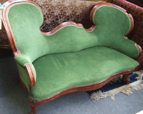 Appraisal: A th century mahogany framed double hump back sofa with