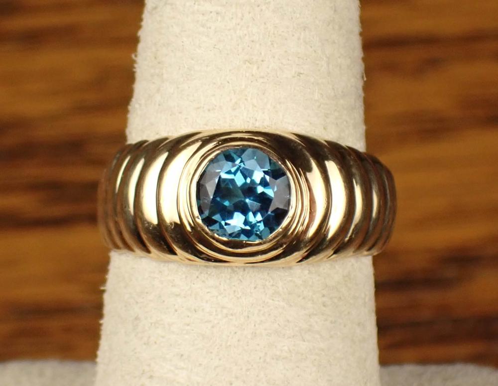 Appraisal: BLUE TOPAZ AND FOURTEEN KARAT GOLD SOLITAIRE RING The yellow