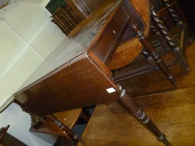 Appraisal: A VICTORIAN MAHOGANY PEMBROKE TABLE standing on turned tapering legs