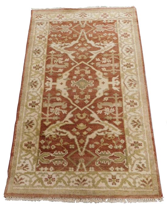 Appraisal: RUG Oushak cinnabar field ensconced in a cream border floral