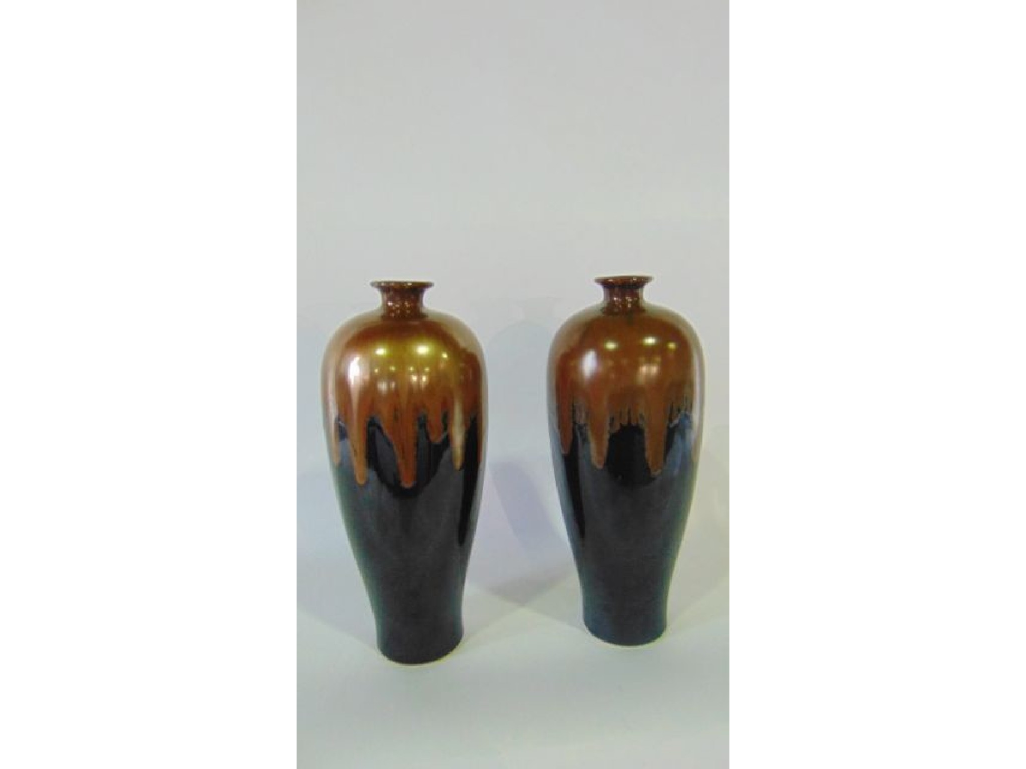 Appraisal: A pair of vases of tapering ovoid form with copper