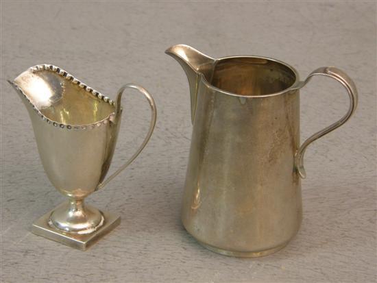 Appraisal: Edward VII silver cream jug high and another silver cream