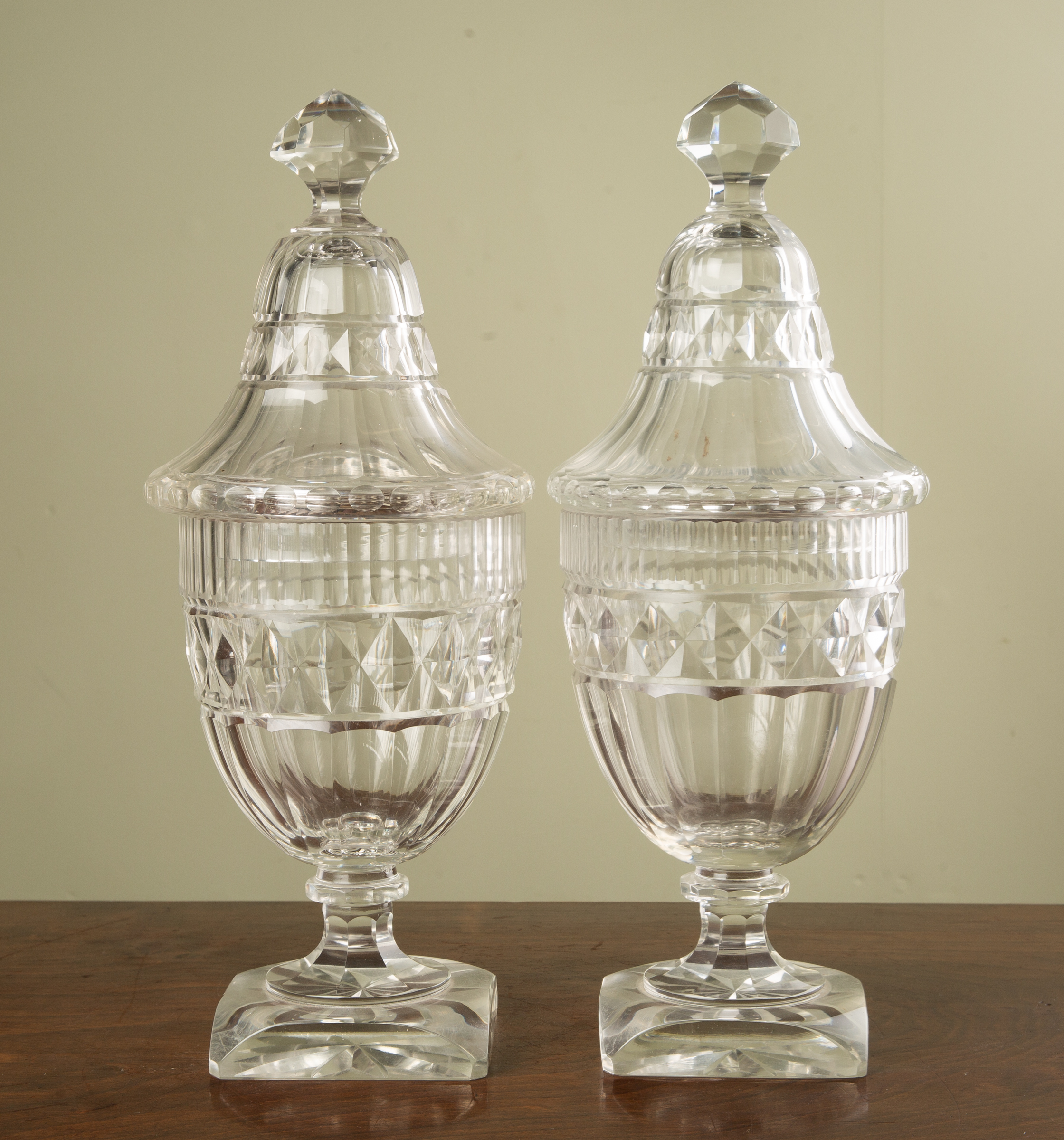 Appraisal: A pair of th century cut glass sweetmeat vases and