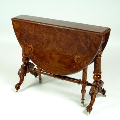 Appraisal: A VICTORIAN WALNUT SUTHERLAND TABLE the moulded edged oval burr