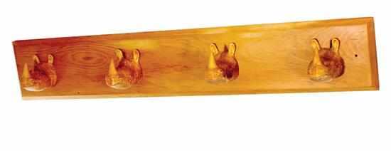 Appraisal: Amusing carved wood wall-mount coat rack rectangular backplate mounted with