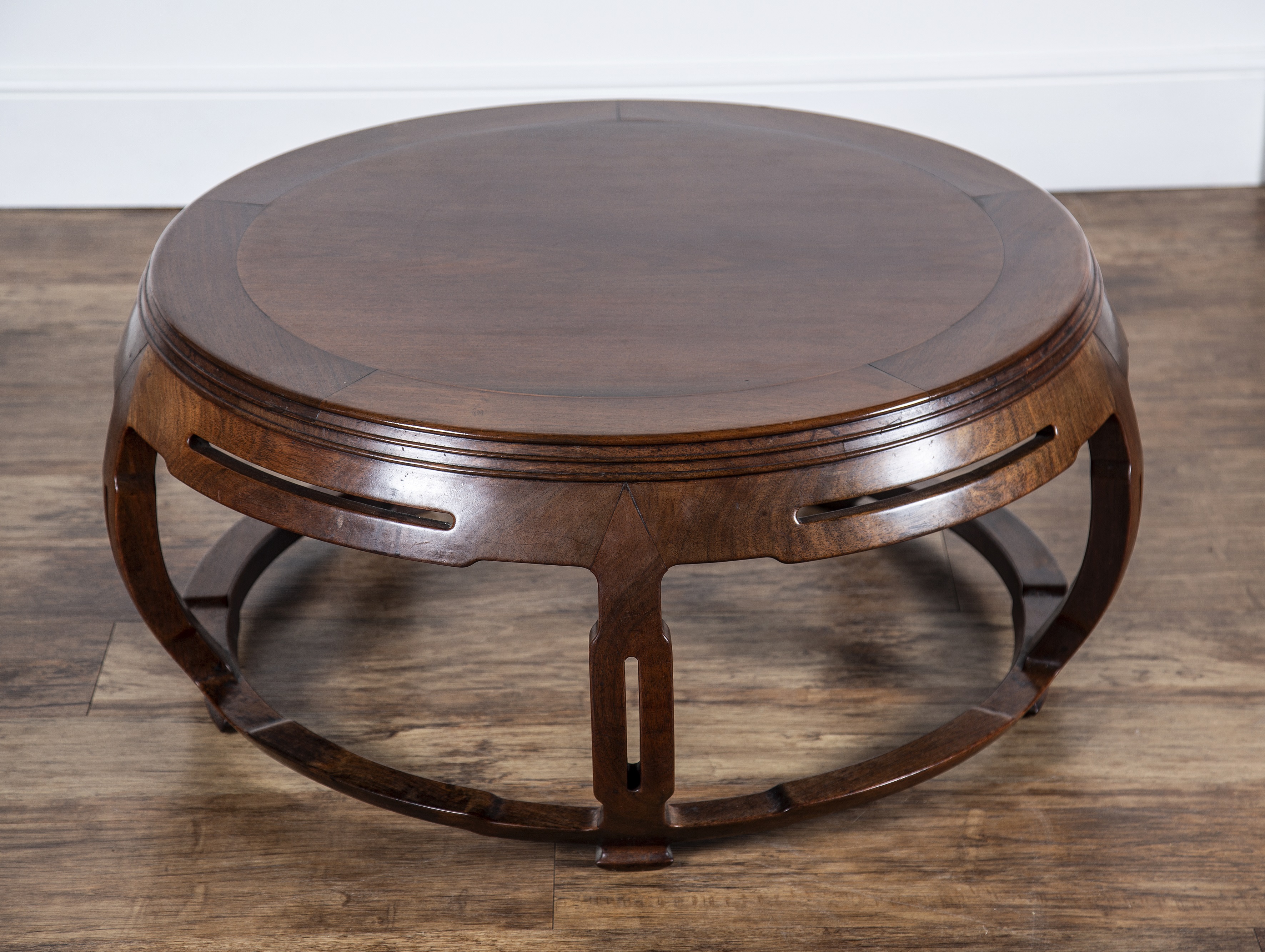 Appraisal: Large hardwood round circular low tableChinese circa of barrel form