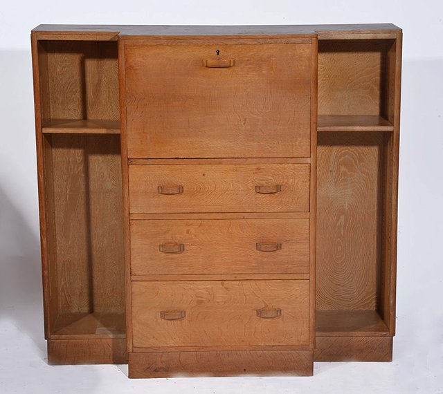 Appraisal: A HEALS OAK BREAKFRONT SIDE CABINET with bureau section above