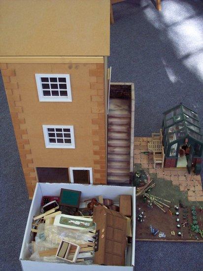 Appraisal: A narrow doll's house North of England style with outside