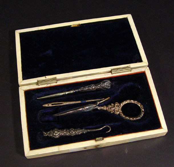 Appraisal: Victorian rectangular mother of pearl manicure set the hinged lid