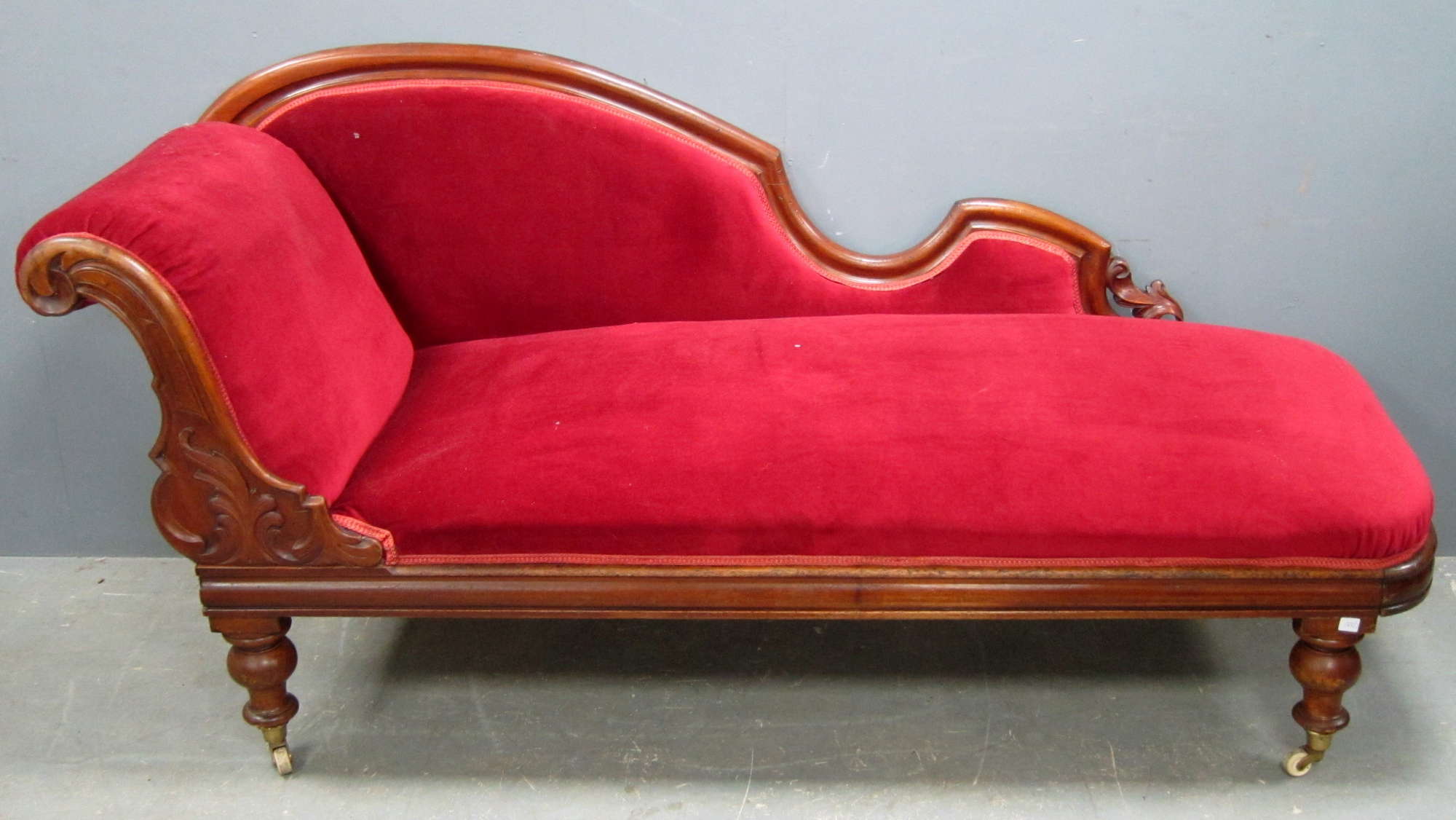 Appraisal: Victorian mahogany framed day bed on turned supports