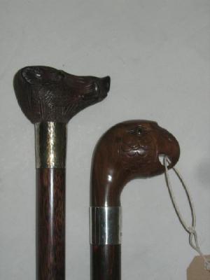 Appraisal: A WALKING CANE with carved hardwood top in the form