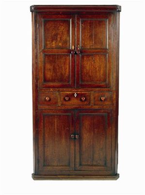 Appraisal: A early th century oak standing corner cupboard with a