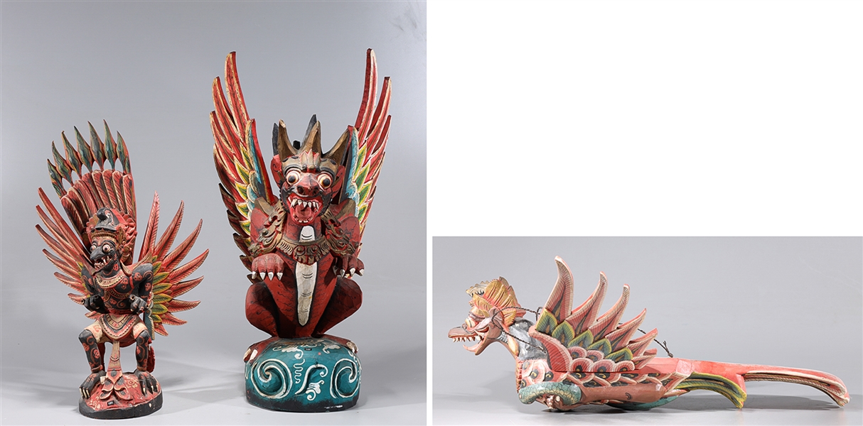 Appraisal: Group of three Indonesian polychrome wood figures each with removable