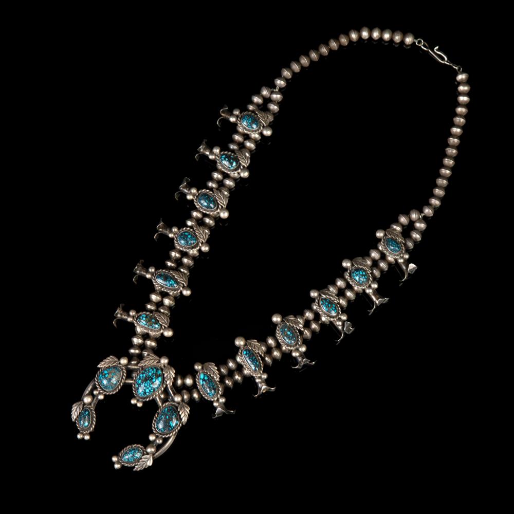 Appraisal: DIN NAVAJO EXTREMELY RARE LANDER TURQUOISE AND SILVER SQUASH BLOSSOM