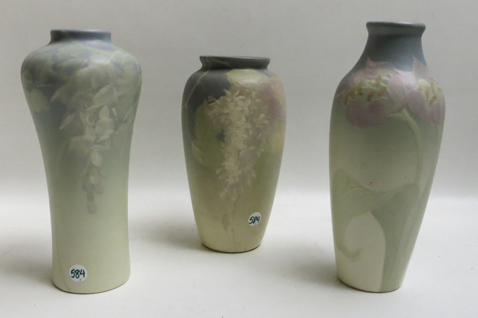 Appraisal: THREE WELLER ART POTTERY VASES in various floral designs each