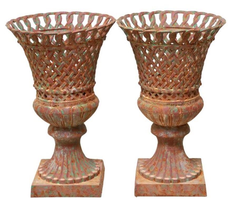 Appraisal: pair Cast iron campana-form garden urn planters in a pierced