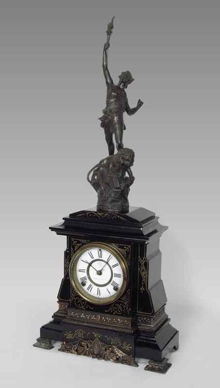 Appraisal: BLACK ANSONIA FIGURAL CLOCK Cast metal figure of man holding