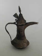 Appraisal: An antique white metal Middle Eastern coffee pot with long