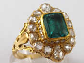 Appraisal: A yellow metal tests carat gold emerald and diamond ring