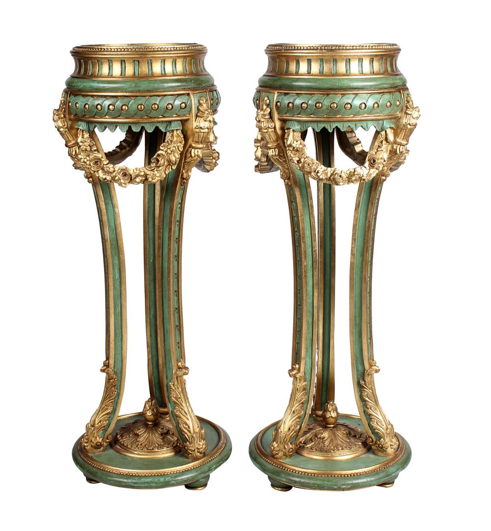 Appraisal: PAIR OF PAINTED PARCEL GILT PLANTERSwith liners Condition paint loss