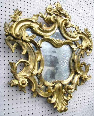 Appraisal: Carved French style wall mirror with floral and scroll motif