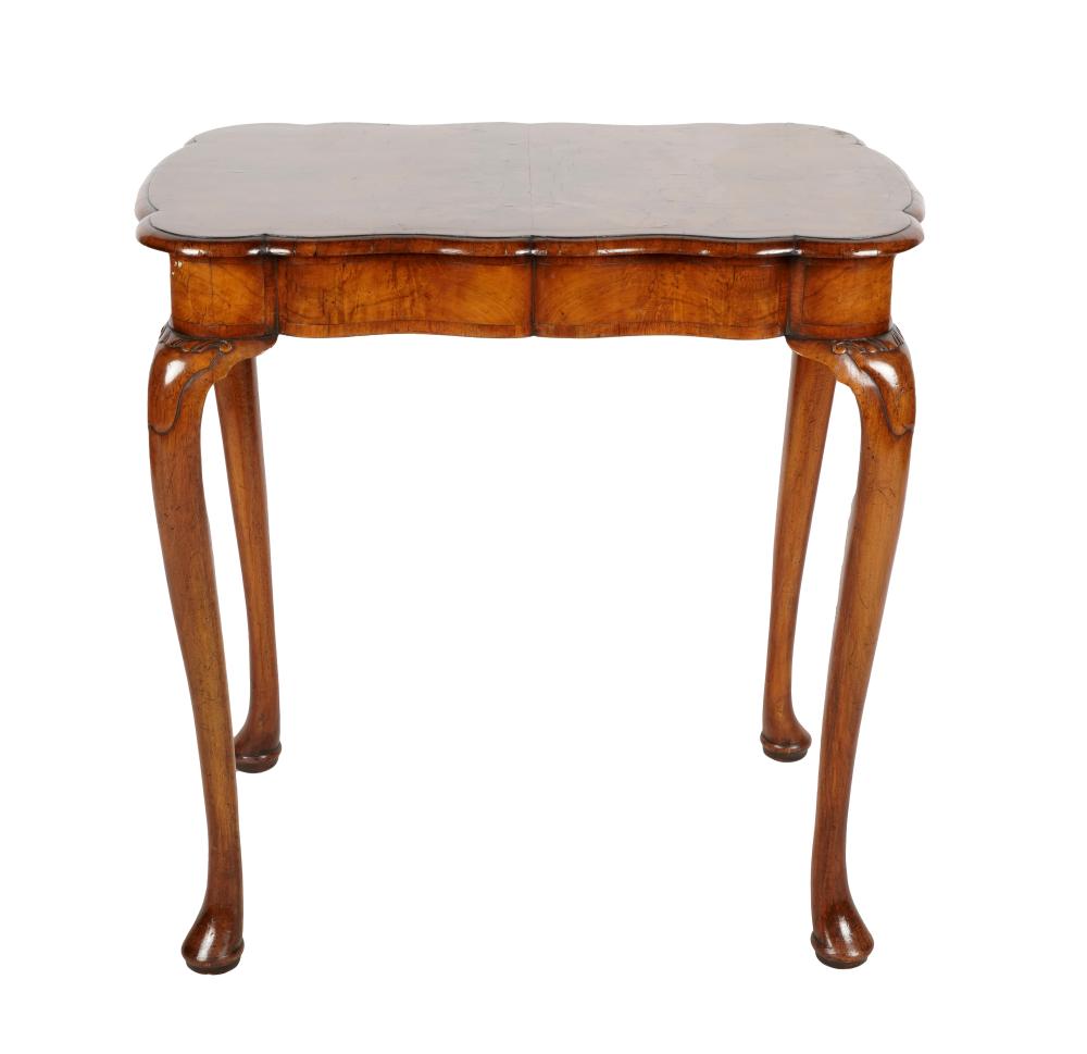 Appraisal: QUEEN ANNE-STYLE WALNUT LAMP TABLE th century with carved detail