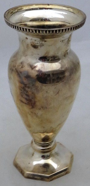 Appraisal: A silver vase of baluster form with a decorated rim