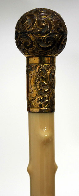 Appraisal: A TH CENTURY WALKING CANE with a bamboo and ivory