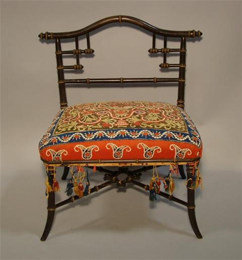 Appraisal: FAUX BAMBOO LOW CHAIR WITH SUSANI UPHOLSTERY Late th century